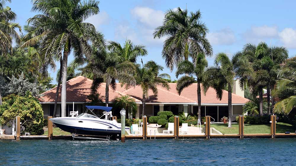 Coastal home with boat dock receiving home inspection services 